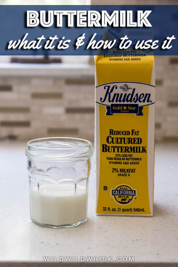 Buttermilk in a glass jar standing next to a buttermilk carton