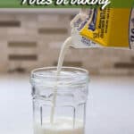 Pouring buttermilk into a glass jar