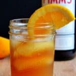 A glass of Pimm's sundowner on a cutting board.