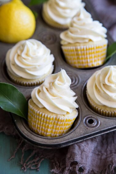 Lemon Cupcakes with Cream Cheese Frosting inside a vintage cupcake pan.