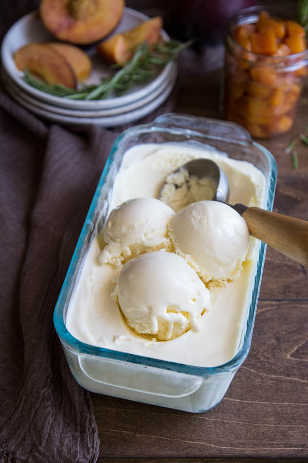 Scoops of mascarpone ice cream in a glass container