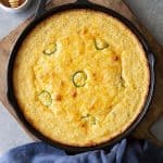 Jalapeno Cheddar Cornbread in a cast iron skillet.