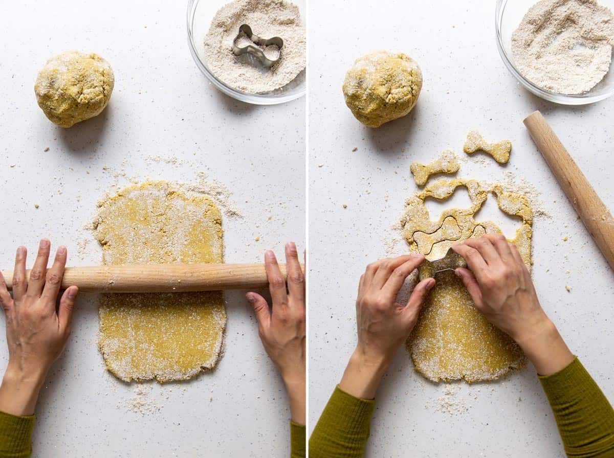 Rolling out the dough and cutting dog biscuits with cookie cutters.