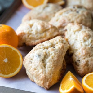 Orange scones on a baking trays with orange slices
