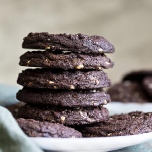A stack of 5 chocolate mint chip cookies.