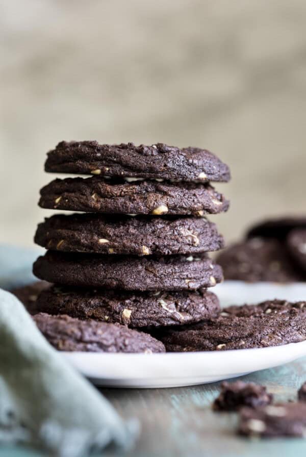 A stack of 5 chocolate mint chip cookies.