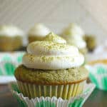 A Matcha cupcake with whipped cream topping