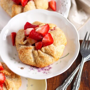 Strawberry galettes on plates stacked on top of each other.