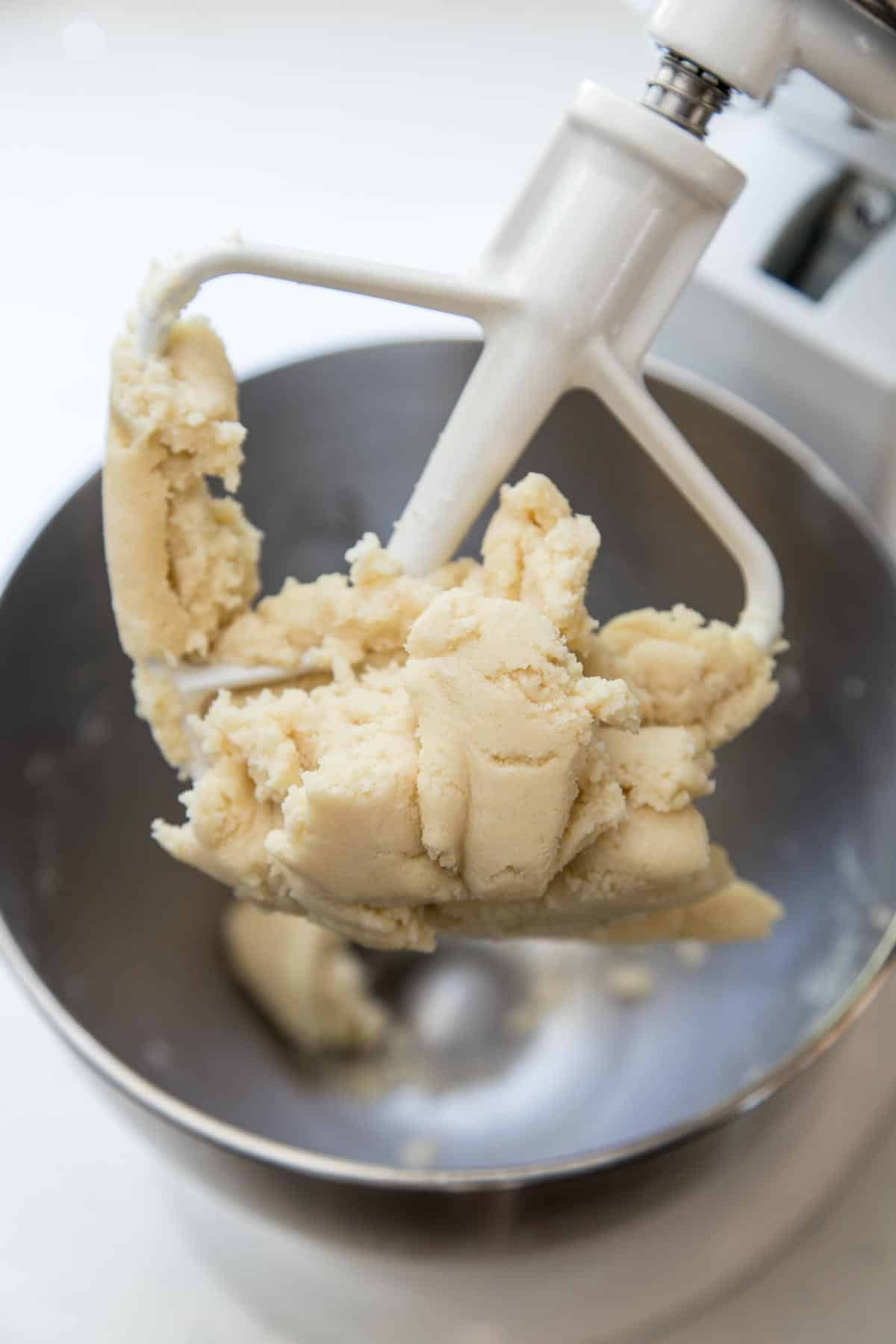 Shortbread cookie dough mixed in a stand mixer.