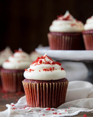 A red velvet cupcake with cream cheese frosting