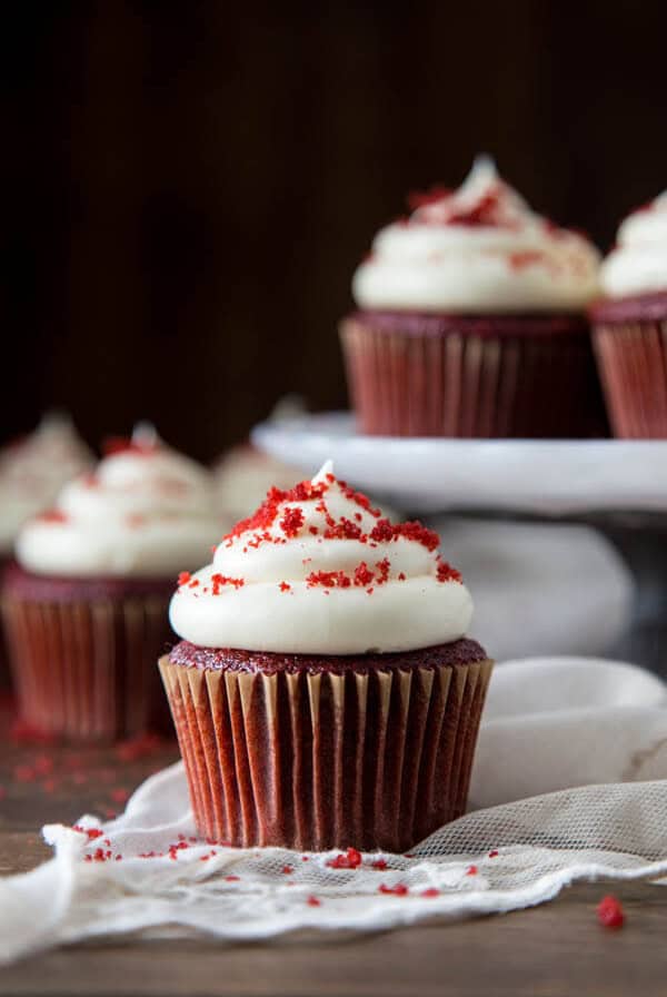 A red velvet cupcake with cream cheese frosting