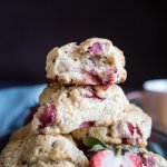 A stack of strawberry scones with one half eaten