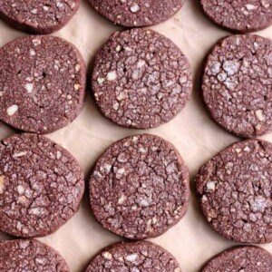 Chocolate shortbread cookies laying flat on a surface