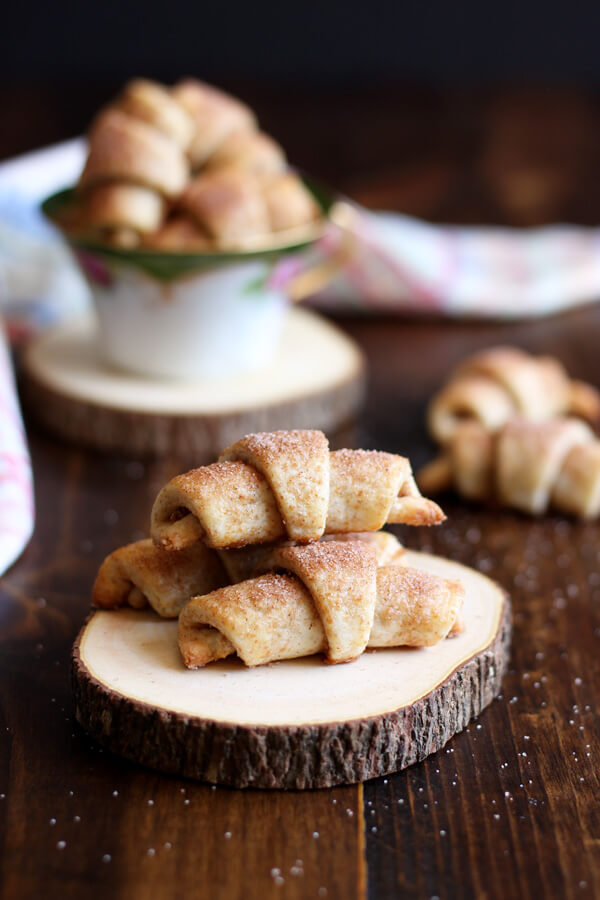Cinnamon Roll Rugelach are scrumptious little bites of tender pastries filled with cinnamon sugar. They are the perfect snack for cinnamon roll lovers.| wildwildwhisk.com