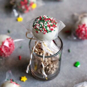 A white chocolate peppermint truffle on a lollipop stick.