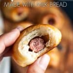 A hand holding a half eaten mini pig in a blanket.