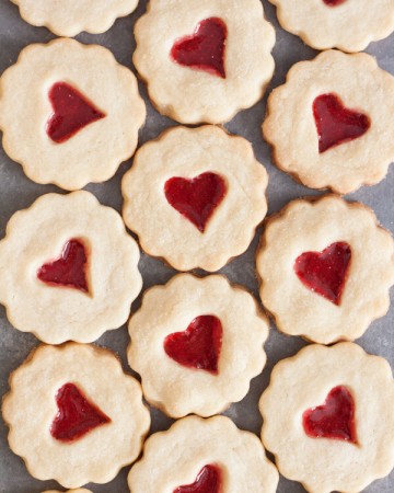 Shortbread cookies with red heart shaped stained glass windows
