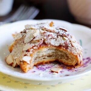 Almond Croissant with a bite taken out.