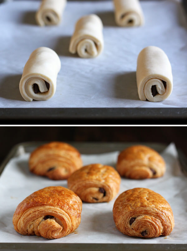 Unbaked and baked chocolate croissants on a baking sheet