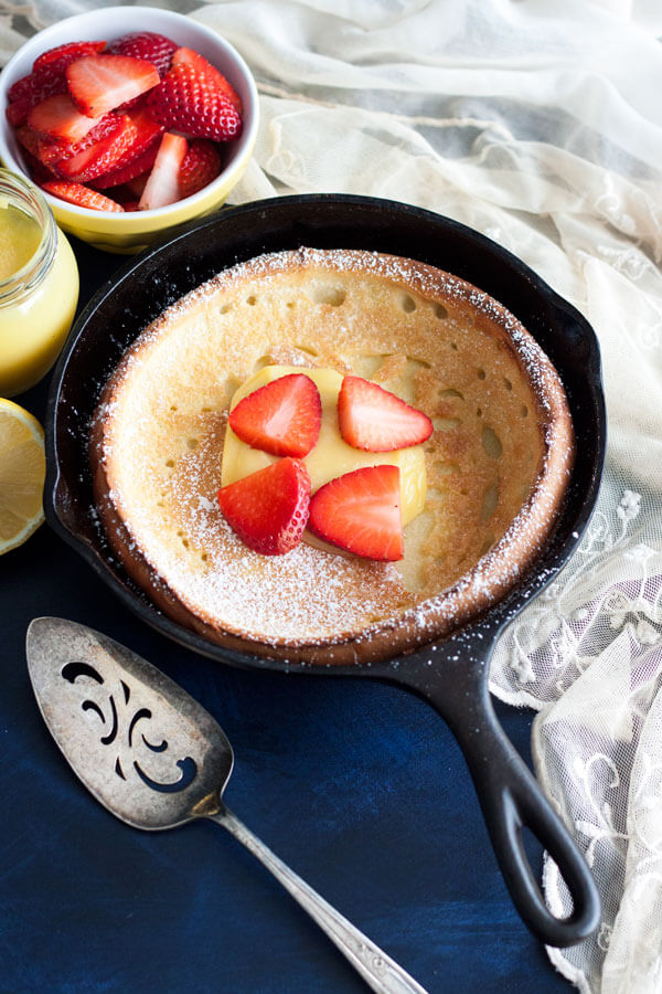 Lemon Dutch Baby dressed up with lemon curd and strawberry slices