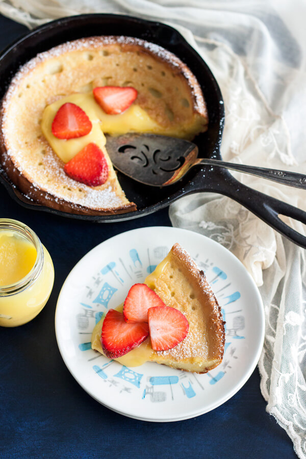 A Lemon Dutch Baby slice on a plate
