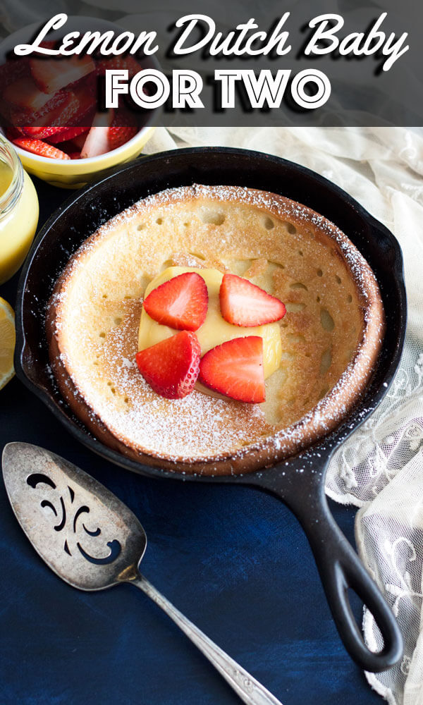 This Lemon Dutch Baby for two is a small batch recipe that’s perfect for you and your sweetheart to enjoy on a slow weekend morning. Served with homemade lemon curd and fresh berries, it is sweet, tart, and refreshing. | wildwildwhisk.com #lemon #dutchbaby