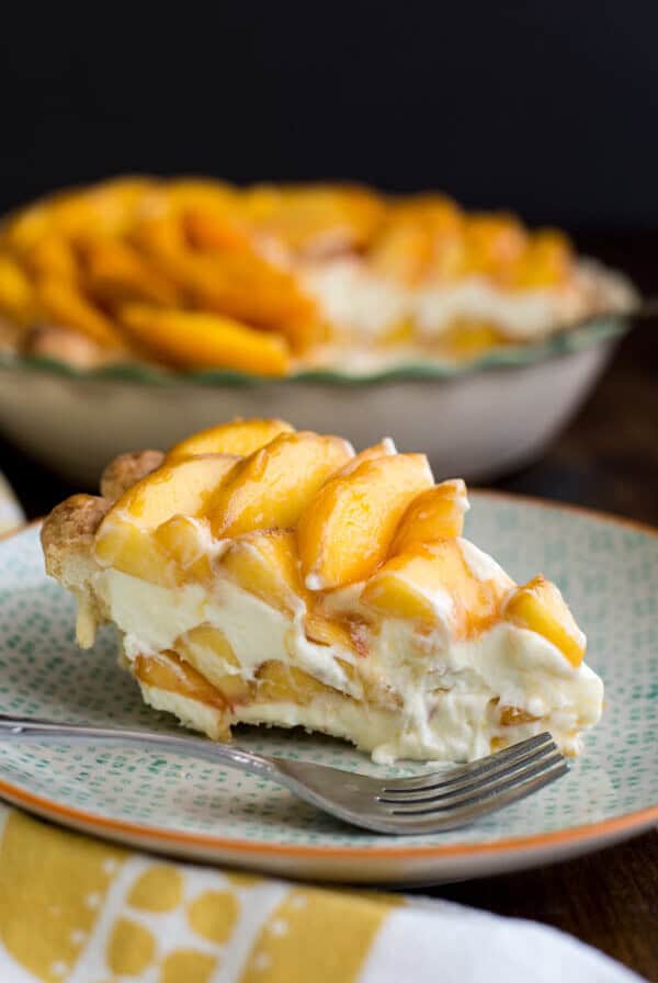 A slice of Peaches and Cream Pie on a plate