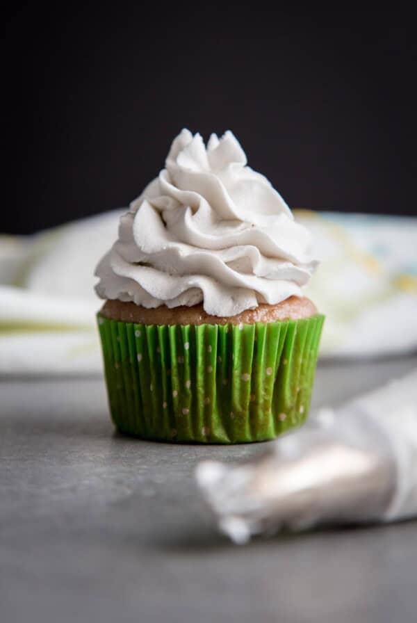 Coconut Whipped Cream on top of a cupcake.