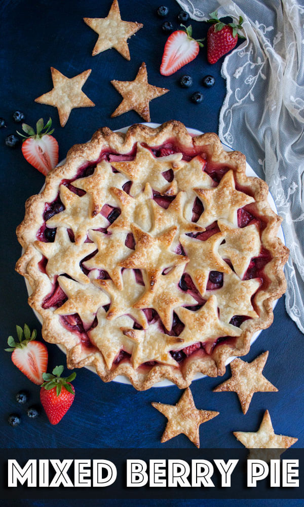 Flaky homemade pie crust filled with a mix of juicy strawberries and blueberries makes this Mixed Berry Pie a delicious summer dessert. | wildwildwhisk.com #berrypie #summerberries #pie