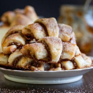 A stack of Fig Jam and Walnut Rugelach on a plate.