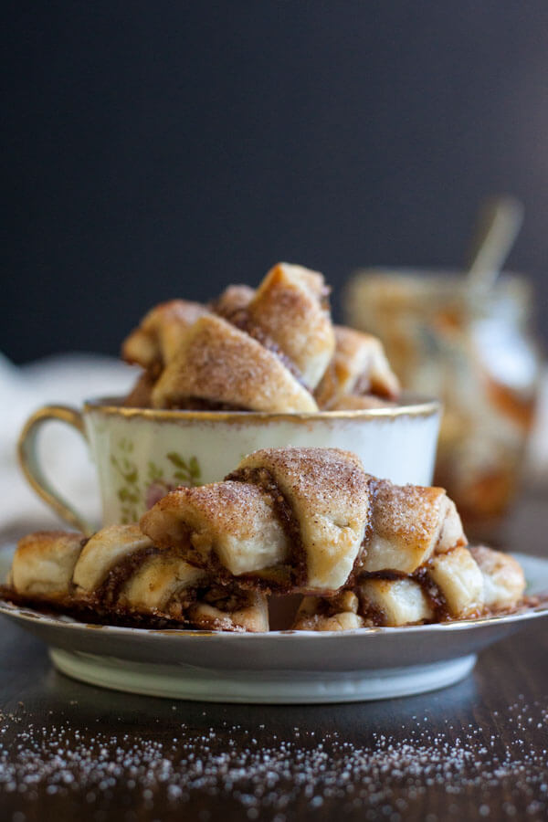 Fig Jam and Walnut Rugelach sitting in a tea cup and saucer