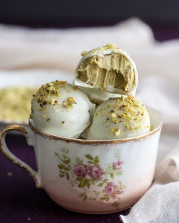 White Chocolate Pistachio Truffles in a tea cup