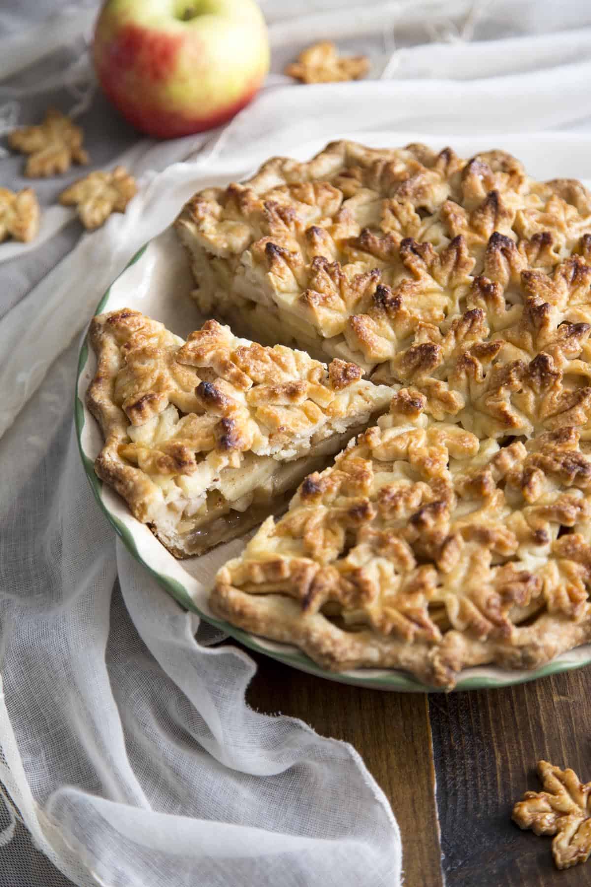 The best Apple Pie with beautiful maple leaf crust in a pie dish