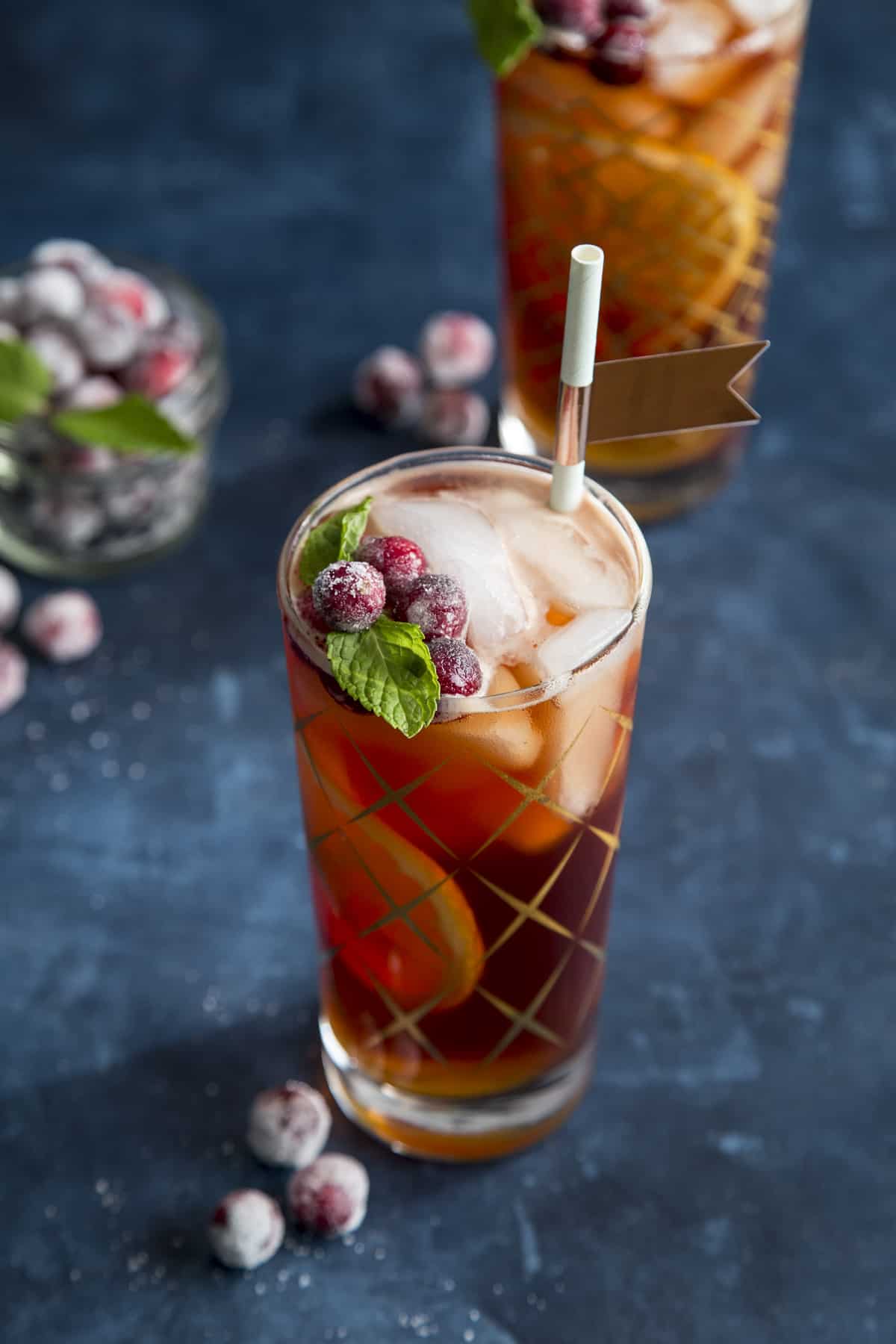 Cranberry Pimm's Cup cocktail garnished with sugared cranberries