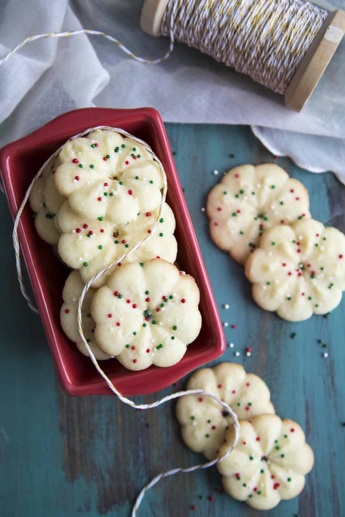 Almond Spritz Cookies in a red container