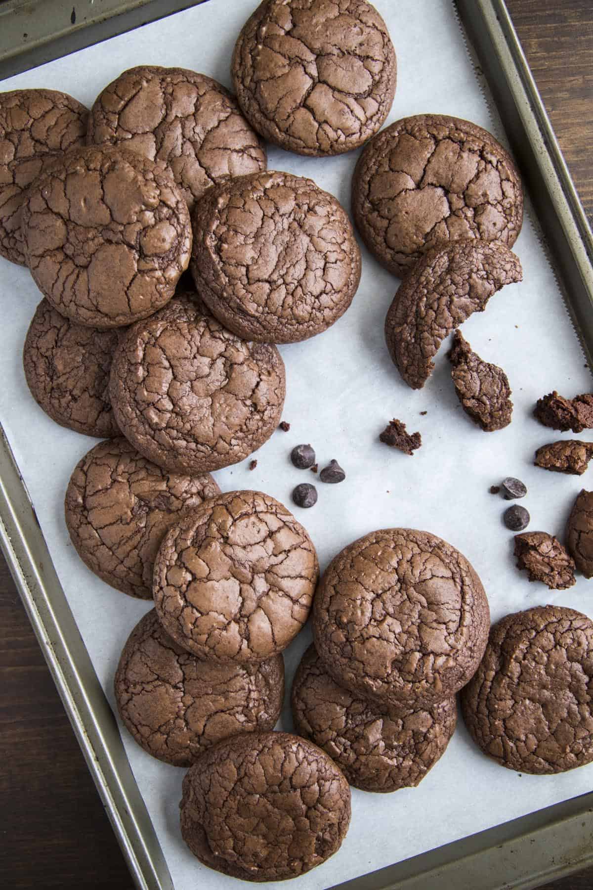 Chocolate brownie cookies arranged on a baking sheet.