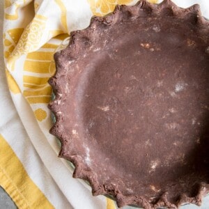 Unbake Chocolate Pie Crust next to a yellow towel.