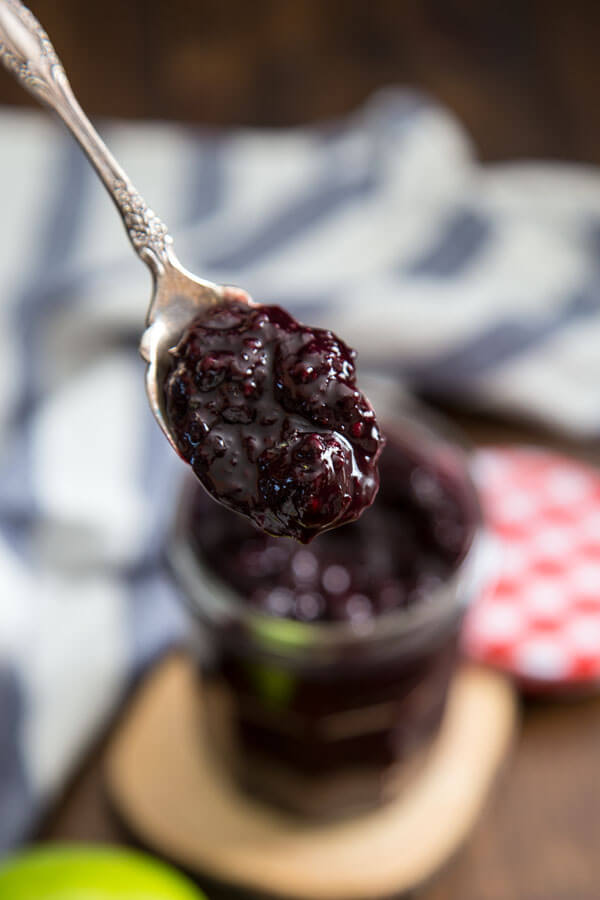 Mixed berry compote on a spoon