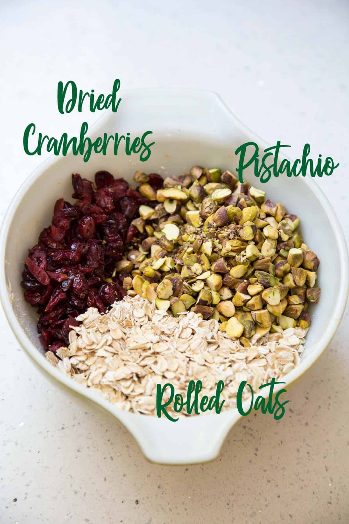 Some ingredients for cranberry oatmeal cookies in a mixing bowl