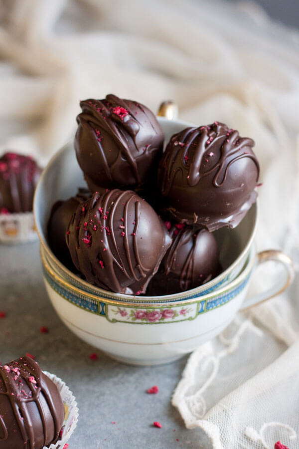 Raspberry Truffles stacked inside a tea cup