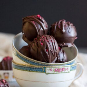 Raspberry Truffles stacked inside a tea cup