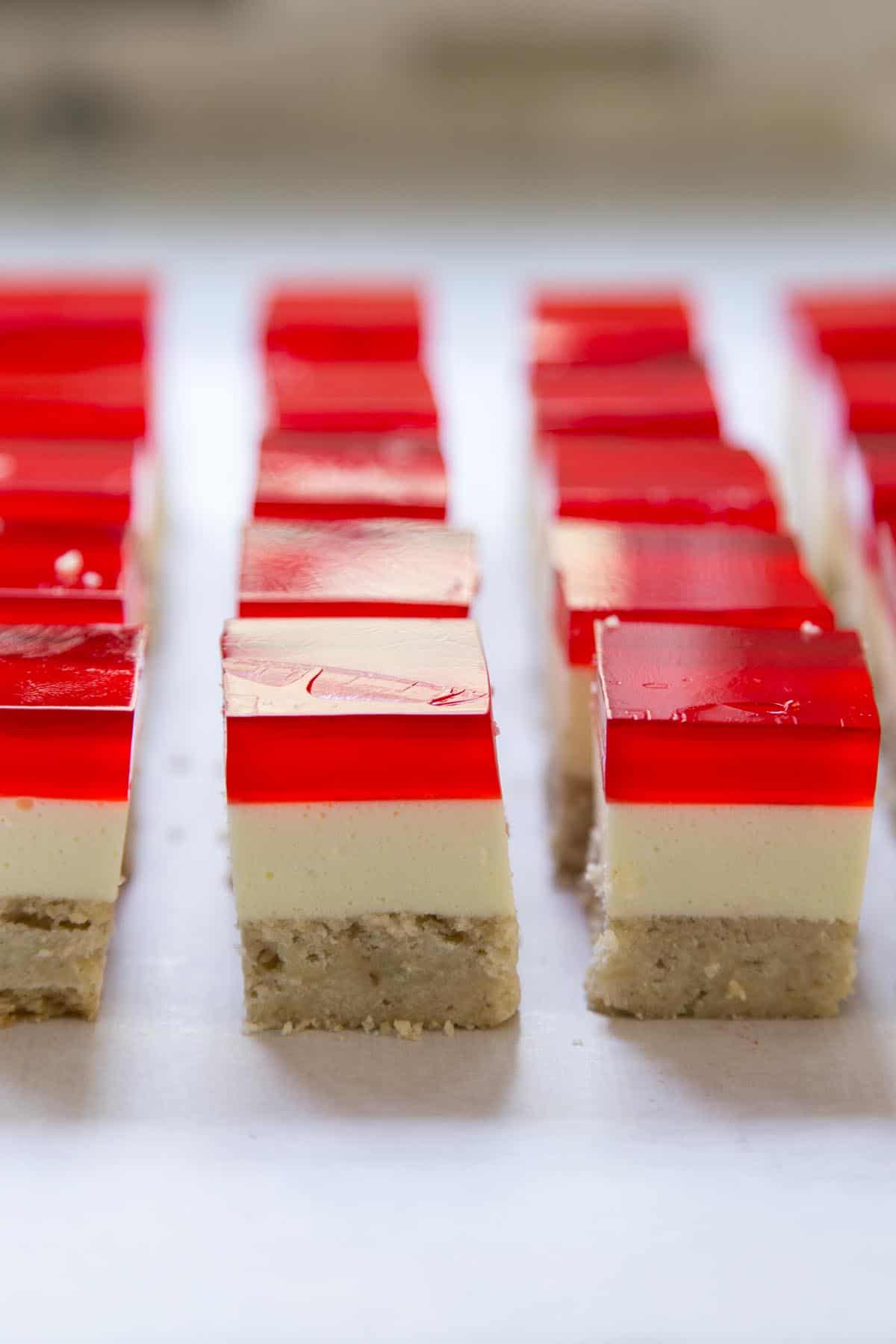 Strawberry Jello Dessert Bars cut into squares