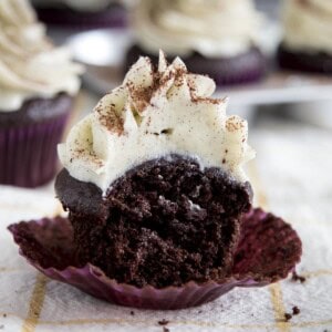 Chocolate cupcake with a bite taken out.