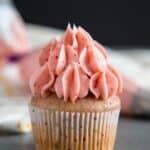 Strawberry Cream Cheese Frosting on top of a cupcake.