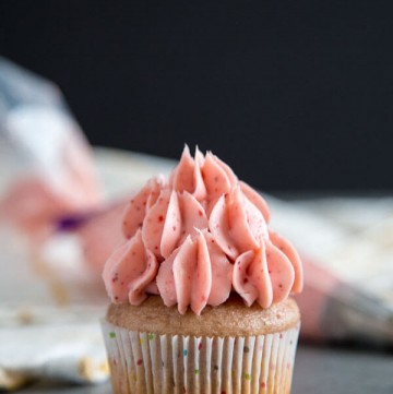Strawberry Cream Cheese Frosting on top of a cupcake