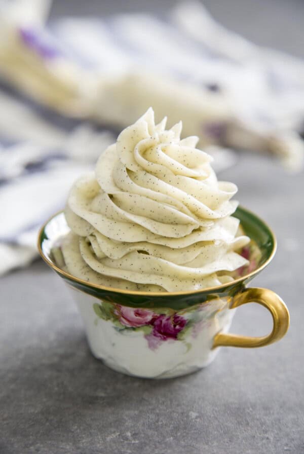 Vanilla bean Swiss buttercream in a tea cup.