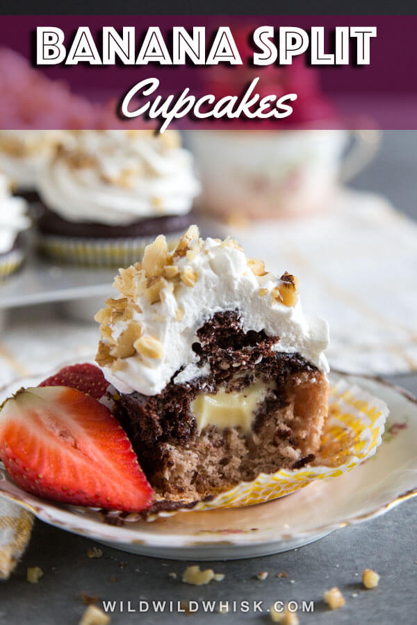 These Banana Split Cupcakes are made with two different cupcake batters, strawberry and chocolate, then filled with a banana flavor pudding. The whole thing is topped with whipped cream and chopped walnuts. #wildwildwhisk #cupcakes