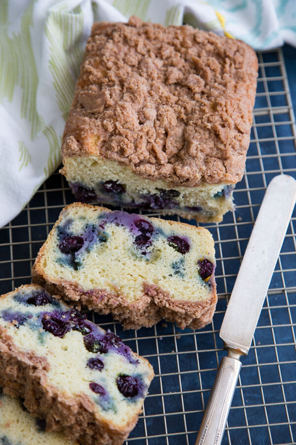 Sliced blueberry coffee cake on a wire rack