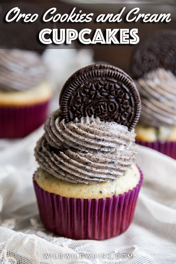 These homemade cookies and cream cupcakes start with an easy vanilla cupcake recipe stuffed with Oreo bits and topped with the best Oreo buttercream frosting. #wildwildwhisk #cupcakes