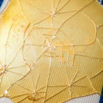 Hardened caramelized sugar on a baking sheet broken into shards